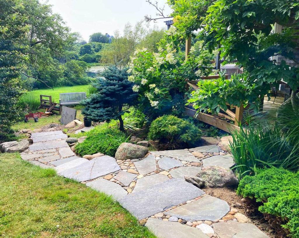 A beautiful walkway through a landscaped garden
