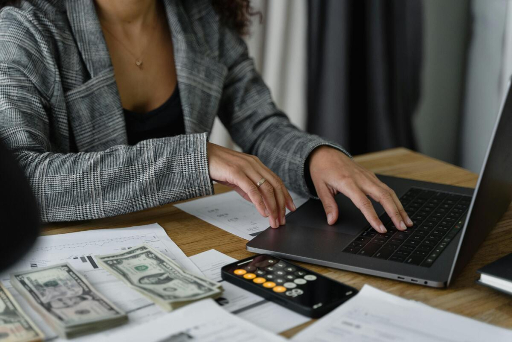 A woman calculating cost on landscape investment