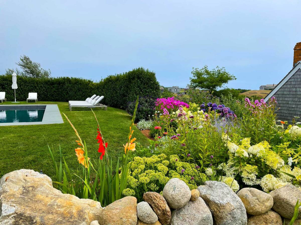 A beautiful landscaped garden with a pool